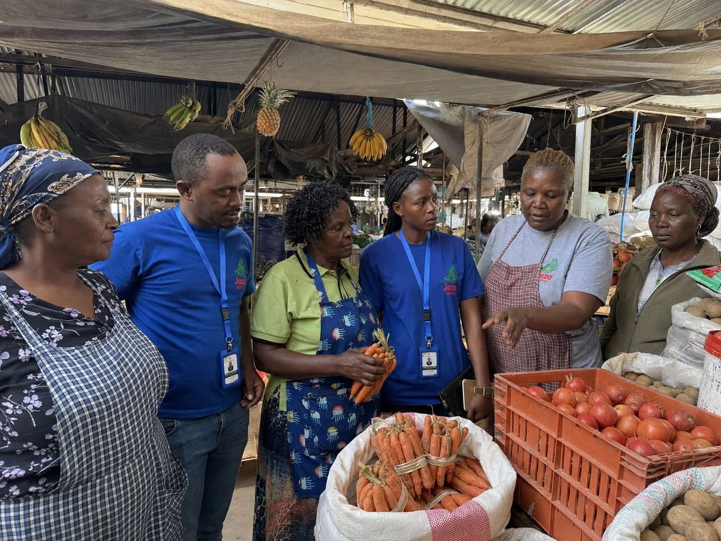 Jaza Capital team engaging women traders in a market